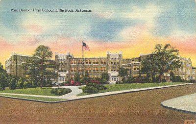 A tinted postcard of Paul Laurence Dunbar High School with a flag flying in front